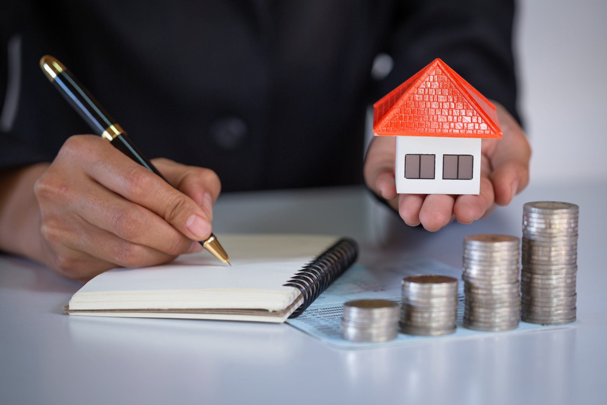 Orange roof houses hands businessmen